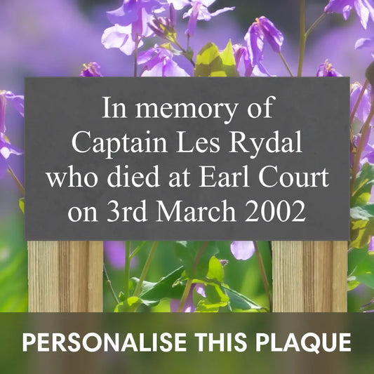 in memory of grave plaque for garden, positioned on 2 wooden stakes