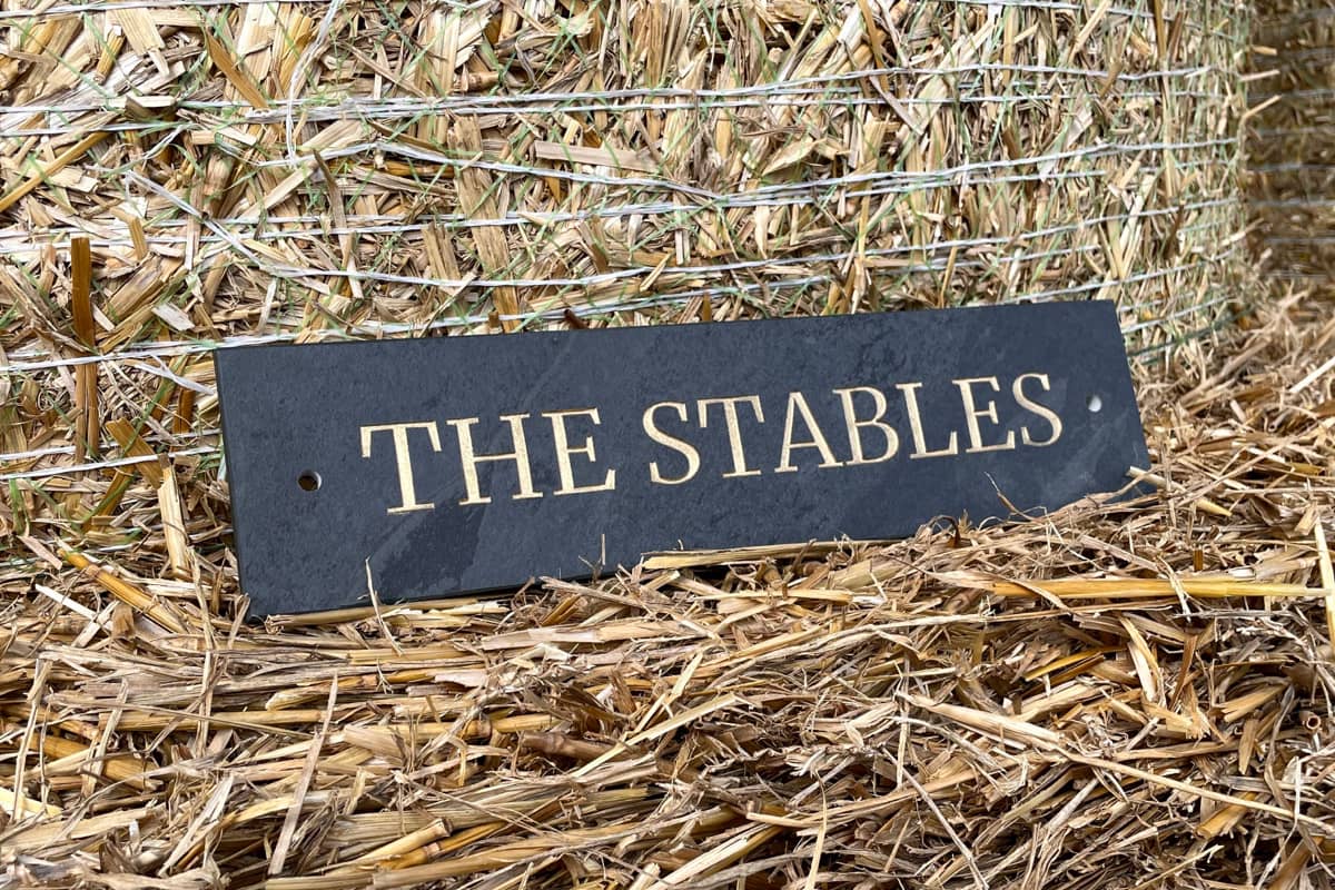 The stables sign