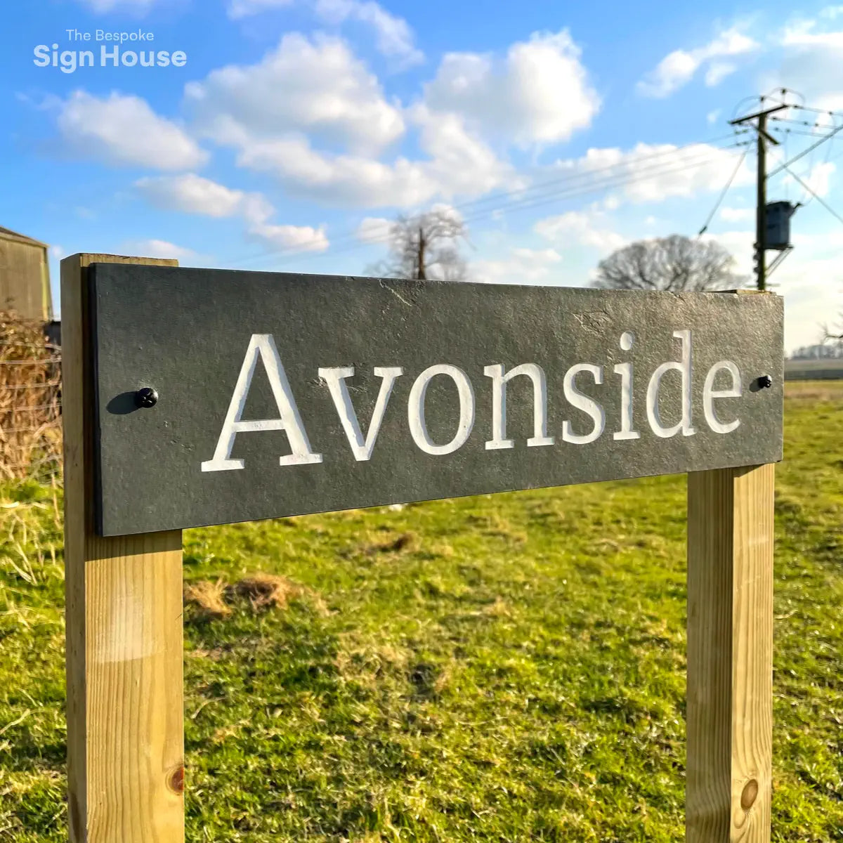 Natural slate sign on wooden posts